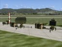 Two different rotating military radars and a SAM missile